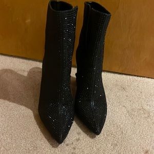 Black heeled ankle booties with all over black rhinestones